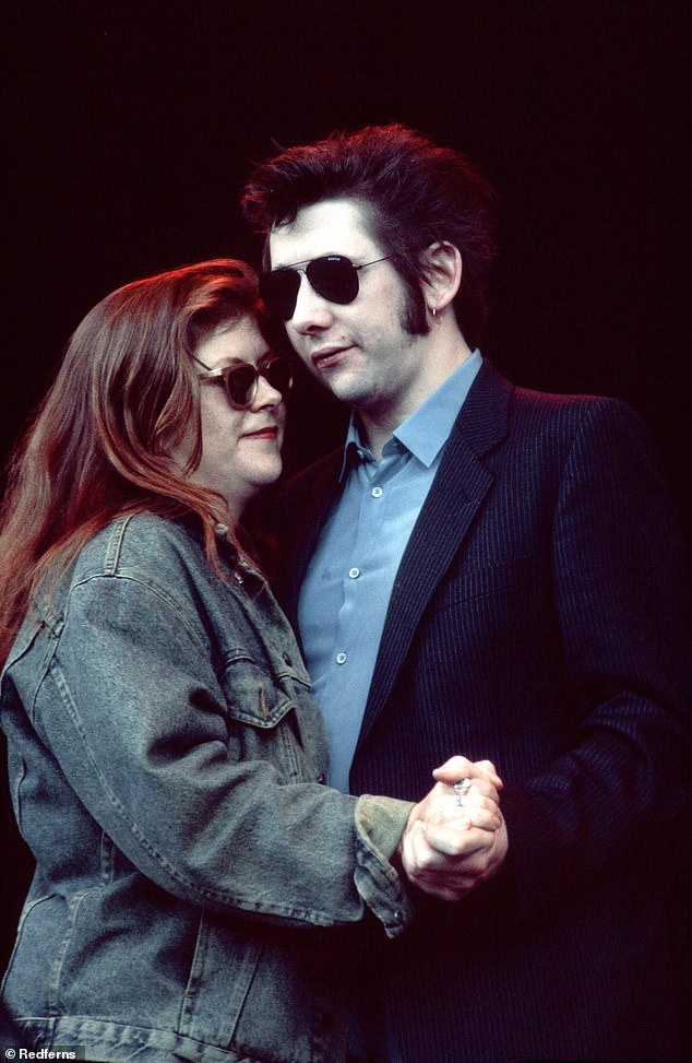 Kirsty MacColl and The Pogues frontman Shane MacGowan, whose death was announced today, dance on stage during a lifetime performance of Fairytale Of New York