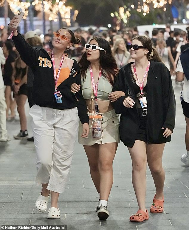 Courtney (left, with her friends Jessica, center, and Skye, right) told Daily Mail Australia that she prefers to wear Crocs because they are more comfortable than regular shoes