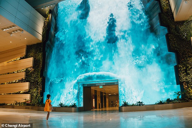 Singapore's Changi Airport, known as the world's best airport, has 'renewed and expanded' Terminal 2.  One of the striking new facilities in the terminal is a 14-meter high digital waterfall