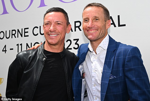 Champion jockeys Frankie Dettori and Damien Oliver pose for a photo ahead of the Australian legend's final Melbourne Cup