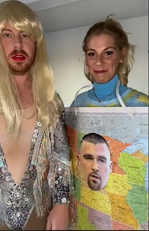 A fan dressed as a card with Travis' face on it and her boyfriend in full Taylor Swift cosplay.  The man slapped Travis' face on his partner's suit as a signal that Taylor was putting the NFL star on the map