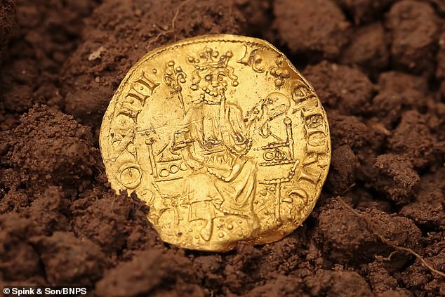 Gold struck!  Discoveries of buried treasure broke records last year in England and Wales – driven in part by a coronavirus-inspired boom in metal detecting.  Pictured is a discovery on a farm in Devon in 2021