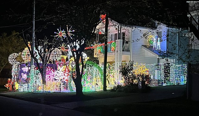 Jamie Lehmann's Christmas lights (above) have been evacuated by Brisbane City Council following a neighborhood dispute last week