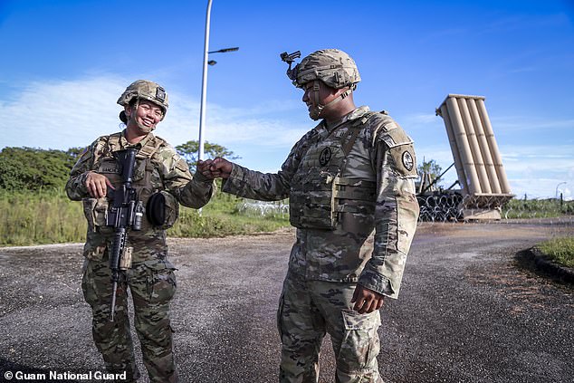 More than 20,000 U.S. troops are currently stationed in Guam.  US Army Sp.  Keo Taianao, right, fist bump Spc.  Sirena Sanchez at the Terminal High Altitude Area Defense missile site "Excalibur" in Dededo, Guam