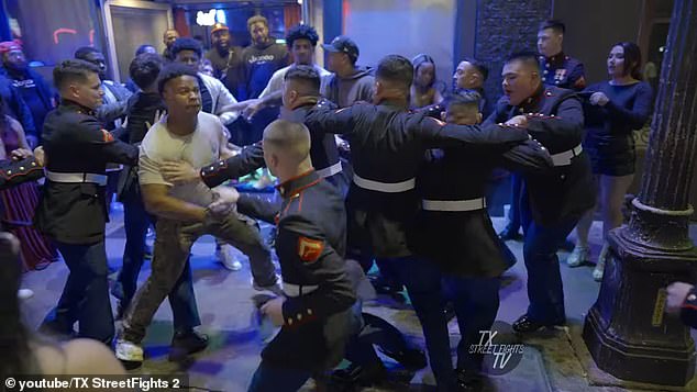 Video shows the moment a nasty fight broke out between a group of uniformed Marines and civilians outside an Austin nightclub