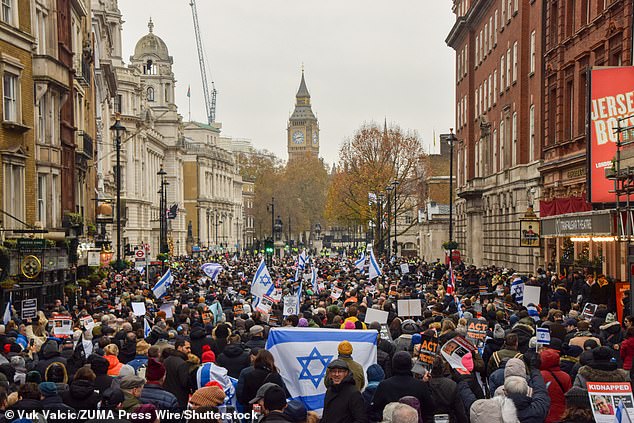 More than 100,000 people marched through central London yesterday in a peaceful protest against anti-Semitism