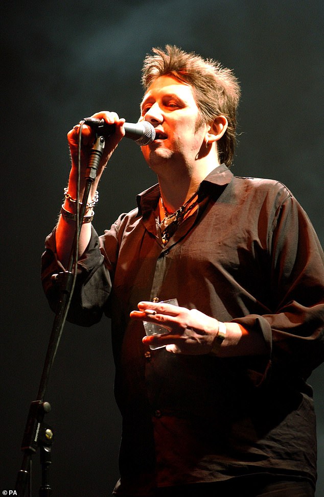 Shane MacGowan (pictured in 2002), the singer and songwriter of the pioneering Celtic punk band The Pogues, has died aged 65.  The legendary Irish rocker, who was behind the iconic Christmas carol Fairytale of New York, died 'peacefully' at 3am today with his wife Victoria Mary Clarke and family by his side