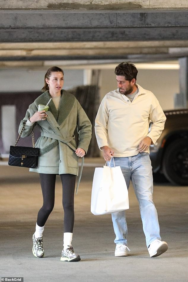 Cozy: Whitney Port and her husband Tim Rosenman stayed cozy as they stepped out in Los Angeles on Wednesday after revealing their surrogate had suffered two miscarriages