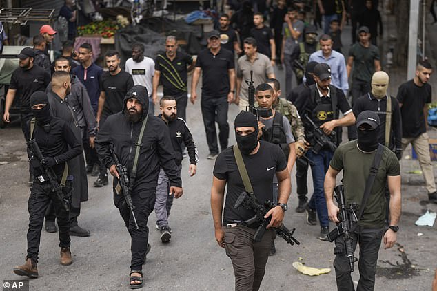 Armed men of Palestinian Islamic Jihad are seen in the West Bank