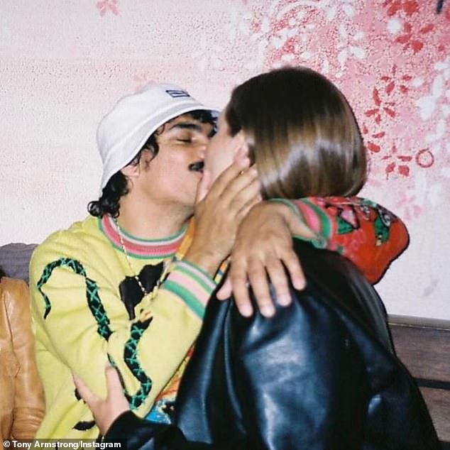 The final photo shared with Armstrong's followers shows a candid kiss, with Armstrong's girlfriend wrapped in a vibrant outfit, her joy unmistakable as she is embraced by him.