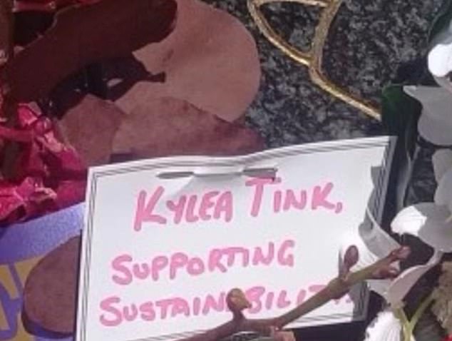 Mrs Tink wrote her name and 'supporting sustainability' on the wreath (pictured), outraged Australian war veterans