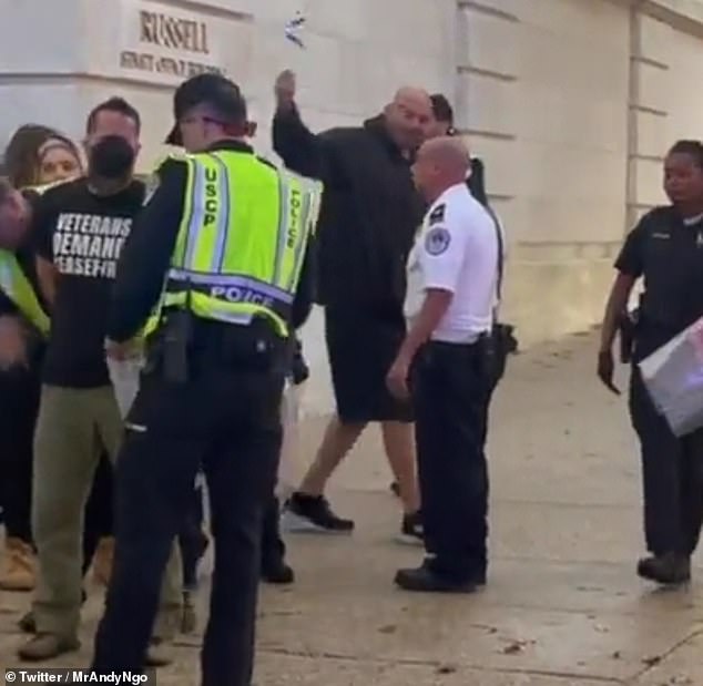 Democrat Sen. John Fetterman sparked a crowd of pro-Palestinian protesters on Capitol Hill Thursday by waving an Israeli flag at those demanding a ceasefire.