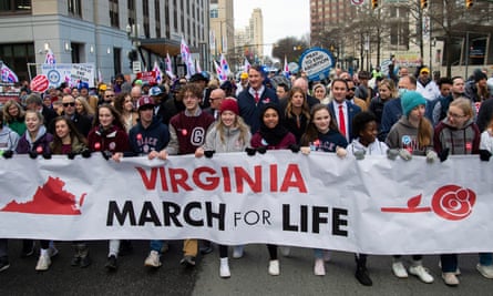 Glenn Youngkin marches with attendees during a March for Life event in Richmond, Virginia.