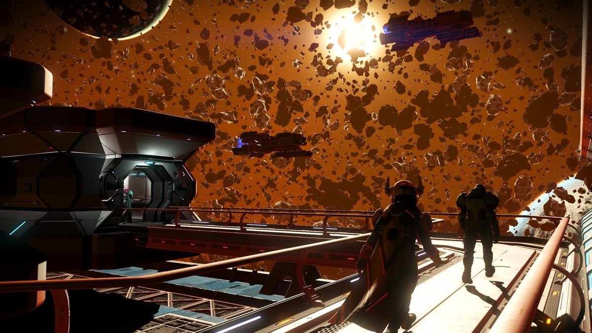 Two explorers walk along the outer walkway of a space station amid a meteor cluster in No Man's Sky