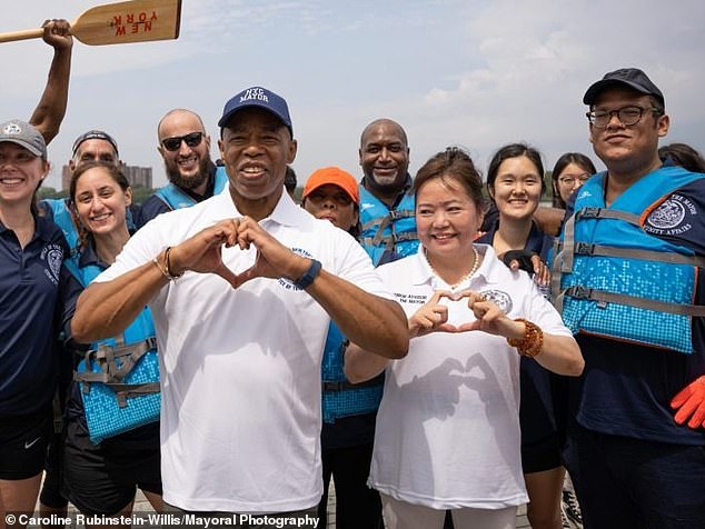 Adams poses with consultant Winnie Greco at the Hong Kong Dragon Boat Festival in August