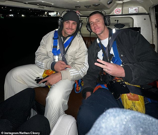 While in the US, the three-time premiership-winning halfback enjoyed a night helicopter flight over Manhattan (pictured)