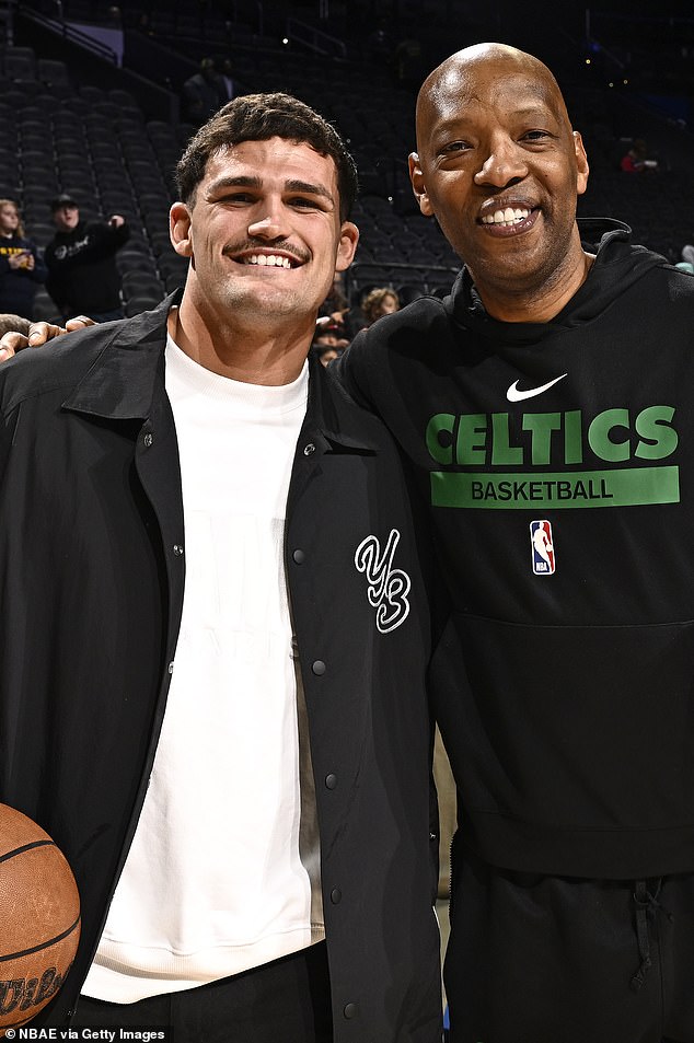 The halfback hurt his knee during the NRL Grand Final, which could delay his return to pre-season training (pictured, with Boston Celtics assistant coach Sam Cassell)