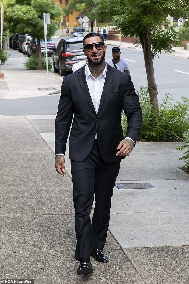 Dressed in a black suit paired with patent black loafers, Hossein Balapour was all smiles as he arrived at Burwood Local Court on Friday.