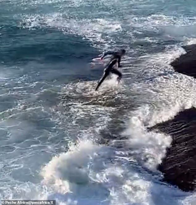 Finally the man manages to escape the swirling current and retreats safely to the beach