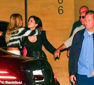 She and Jeff walked hand in hand as they left the sushi restaurant, stopping to say goodbye to a few friends before getting into their waiting car