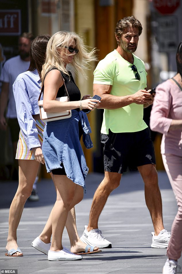 Anna met husband Tim (pictured), who stepped out in a bright neon shirt and black shorts