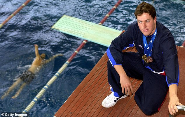 The former swimmer, pictured in 2002, saw his life take a 'hard and dark turn' when he retired