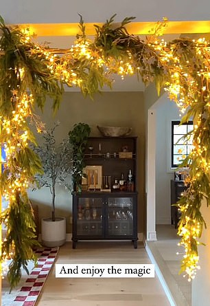 She revealed that all you need is a shower or curtain rod, some garland and a string of Christmas lights to put a festive twist on your home.