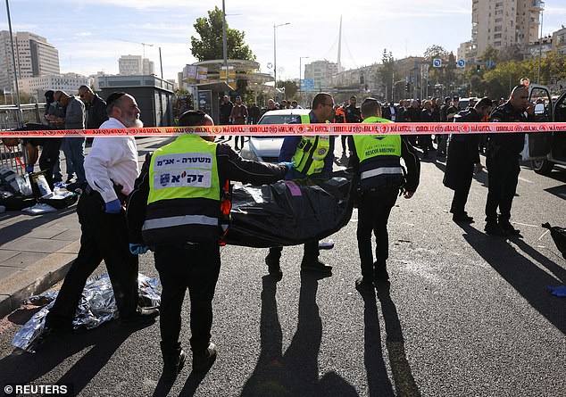 Israeli officials work at the scene of a violent incident in Jerusalem on November 30, 2023