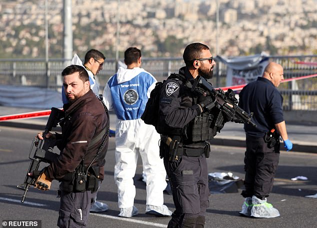 Israeli armed police stand guard at the scene of a violent incident in Jerusalem on November 30, 2023