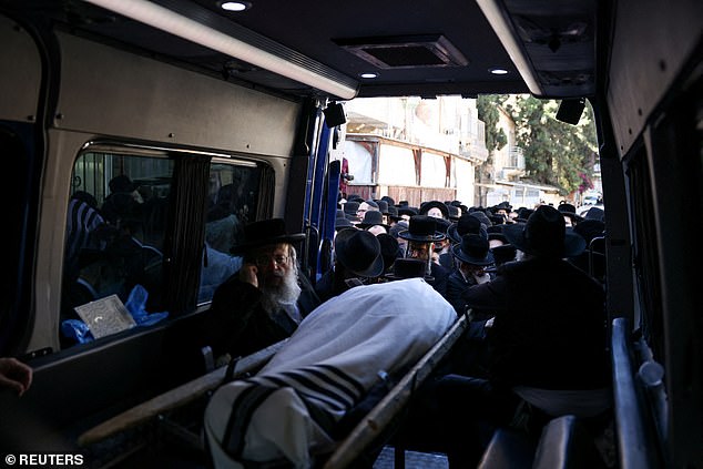 The body of rabbinical judge Elimelech Wasserman, who was killed in a shooting at a bus stop at the entrance to Jerusalem, will be placed before his funeral on November 30, 2023.