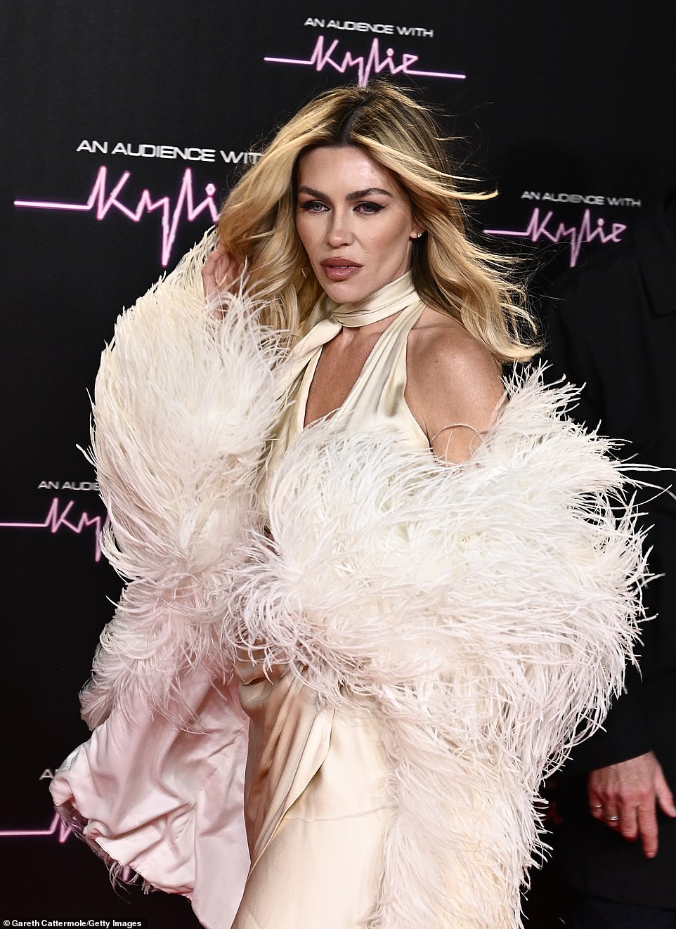 Abbey slipped her feet into a pair of black, sparkly heels as she strutted her stuff on the red carpet, before Australian Kylie, 55, who took to the stage