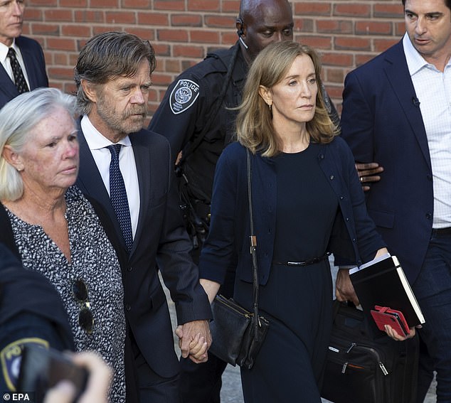 Reader, don't be fooled by the perfectly shaped blow-dry and newly bleached hair that Felicity suffered during her eleven days in captivity – and she wants us to know about it.  (Photo: Huffman and her husband William H. Macy outside court in 2019).