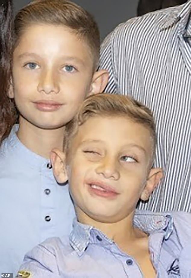 The boys were asleep and alone at home when terrorists launched their barbaric attack on their village.  In the photo: Yagil (R) and Or Yaakov (L)