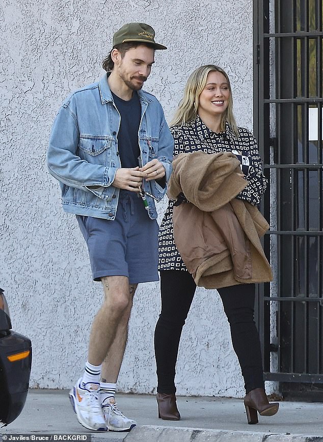 The 36-year-old actress looked effortlessly stylish in a black and white printed button-down, teaming it with fitted trousers and brown leather boots for their outing