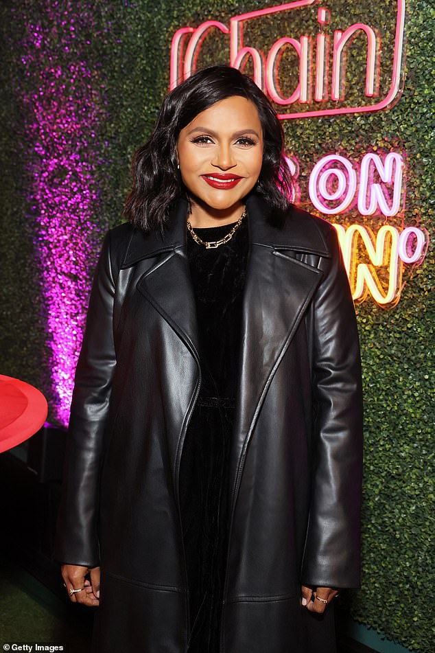 The Mindy Project star, 44, looked chic in a long black Matrix-style leather coat, which she wore over a black dress and paired with cream over-the-knee boots