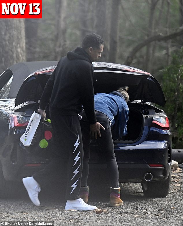 Holmes and Robach spent the weekend in a cozy cabin in the Shawangunk Mountain region, checking out their rental on Sunday, November 13.  Holmes gave his lover a playful squeeze from behind as she packed the car.