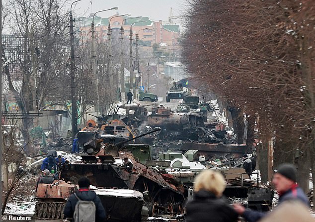 Russian tanks are piled into heaps of twisted rusting metal seen in Bucha, on the outskirts of Kiev, amid heavy fighting on March 1, 2022