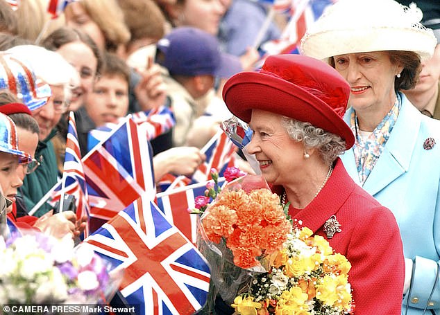 The late Queen with her 'Head Girl' Lady Susan in Aylesbury Market Square in 2002