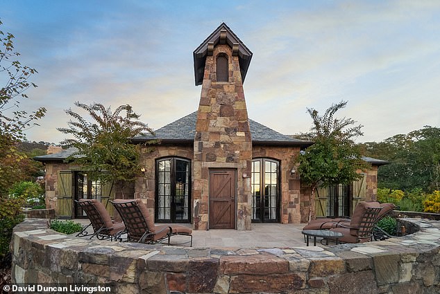 Located just 30 miles from San Francisco, the main building features stone walls, reclaimed wood beams, a slate roof, a library and two offices, one with a terrace.