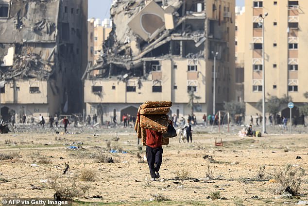 Hamas fired dozens of rockets into Israel yesterday, but no injuries were reported.  (Residents of the Qatari-funded Hamad Town housing complex in Khan Yunis in the southern Gaza Strip carry some of their belongings as they flee their homes)
