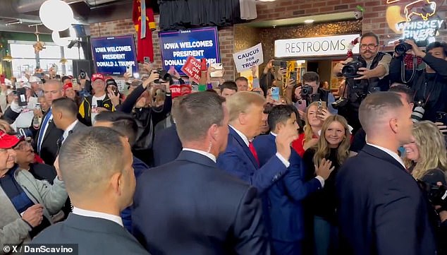 A huge crowd gathered at the bar to cheer and take selfies with the twice-impeached president