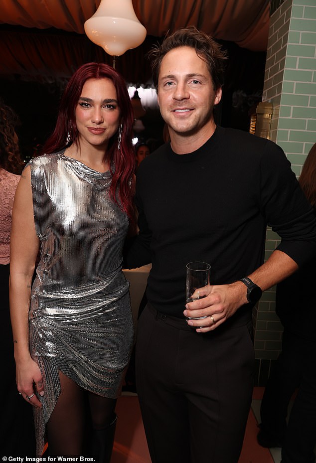 Dua and Margot Robbie's husband Tom Ackerly posed together