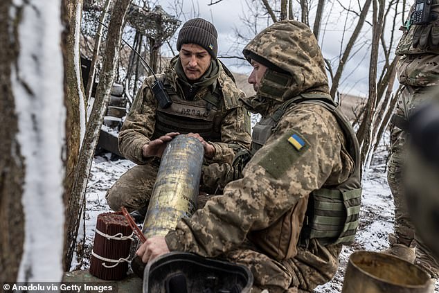 Ukrainian soldiers of the 57th Brigade prepare the explosive artillery attack, in their combat position, towards Kupiansk in Kharkiv Oblast, Ukraine, on November 27