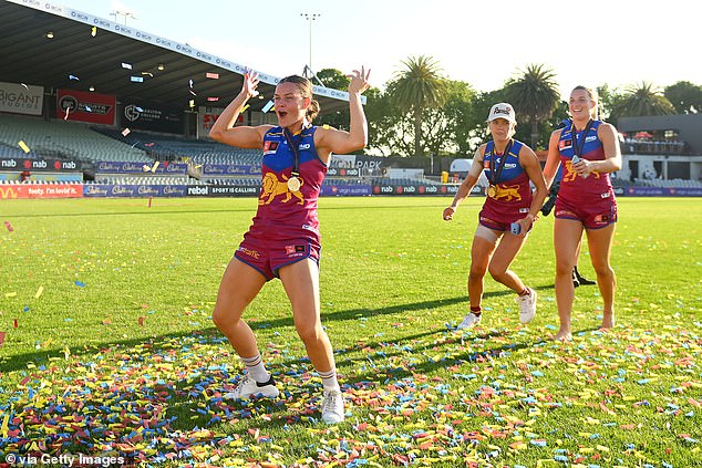 The Lions' Sophie Conway celebrates as she wears her premiership medal