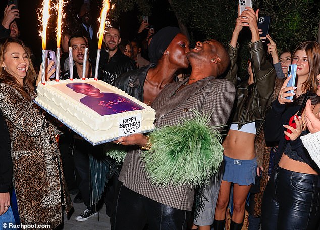 Newly single Jodie Turner-Smith gave Vas a kiss on the cheek as he held his birthday cake, which had a photo of his younger self printed on it
