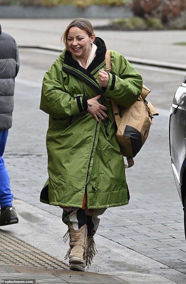 Singer Charlotte, 37, wore a green jacket that ended below her knees, while underneath she wears navy blue, green and white trousers