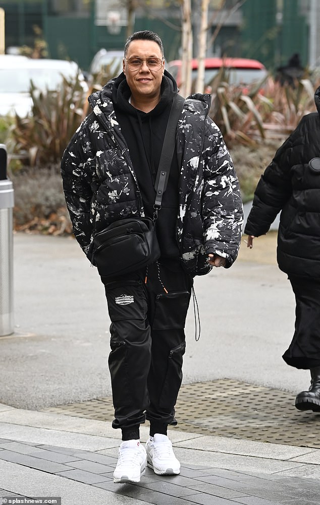 They were accompanied by Gok Wan, who donned a black jacket with a white splatter design.  The television host, 49, wore a black hoodie and cargo pants in the same color