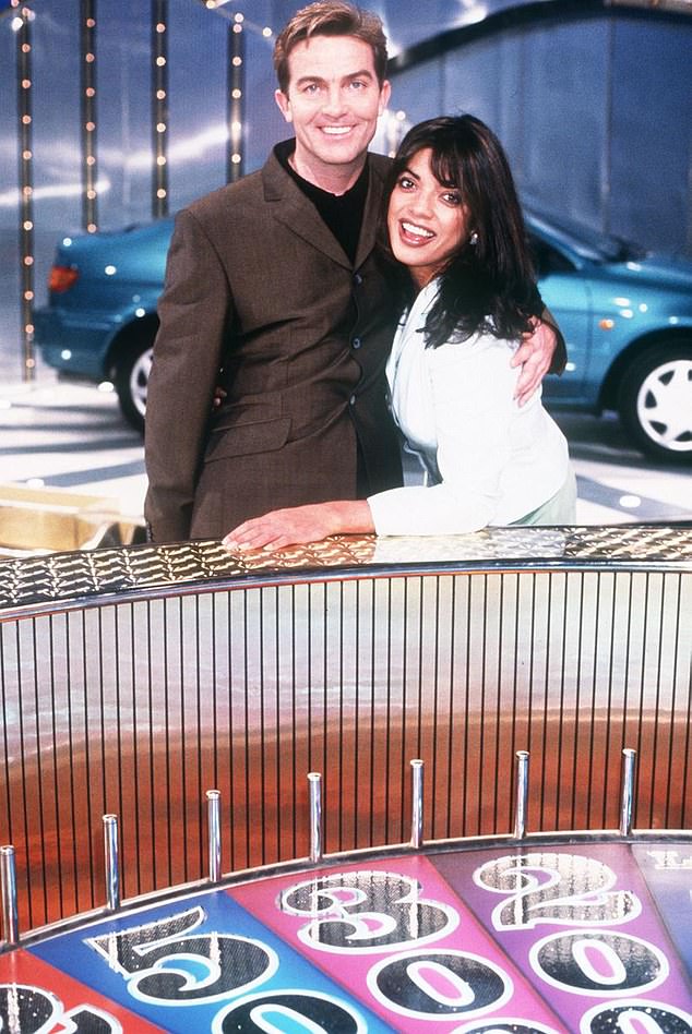 The ladies would serve as glamorous assistants on the show as they helped reveal the invisible letters (Jenny Powell and Bradley Walsh pictured in 1997)