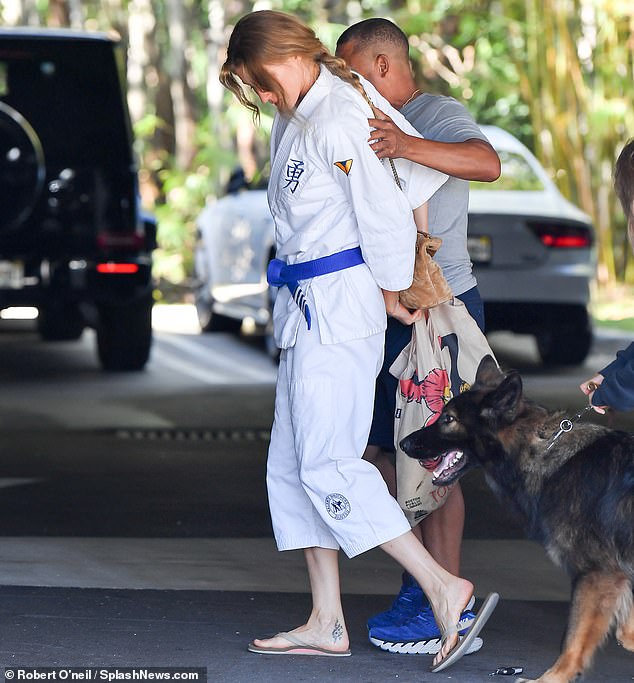 The fashion industry personality wore a bright white gi and a blue belt, which she got last year, before entering the training center