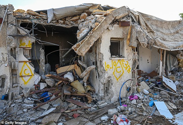 A house in ruins after an attack by Hamas militants on this kibbutz days earlier, when dozens of civilians were killed near the Gaza border on Tuesday